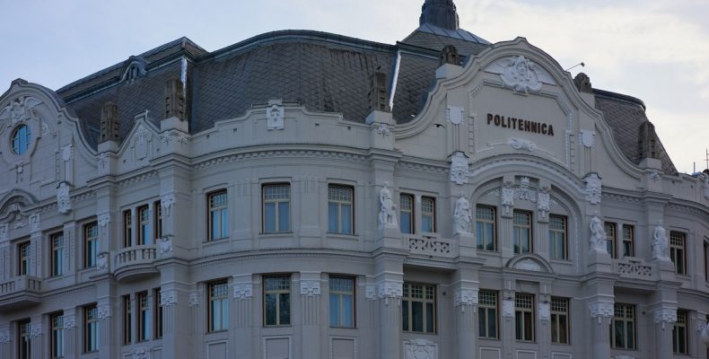 a large building with a clock on the top of it